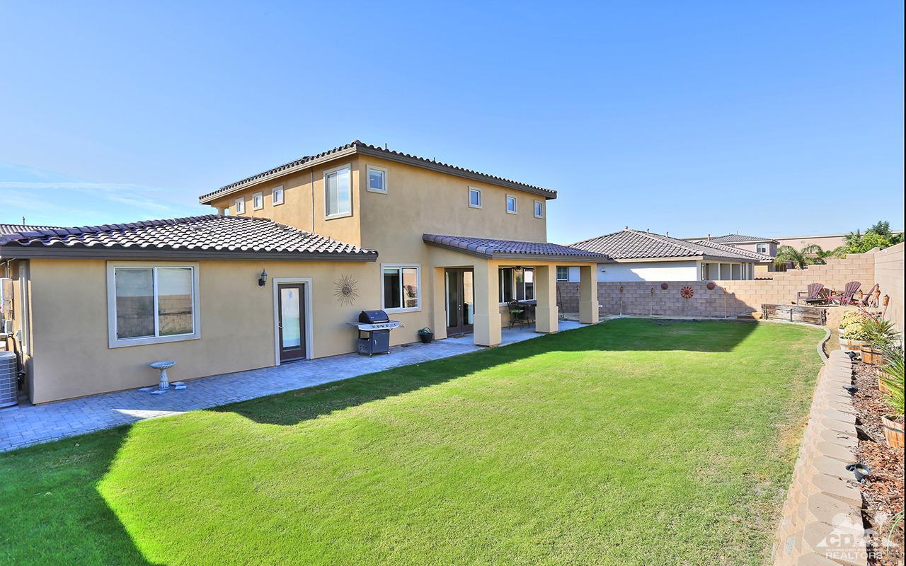 83330 Lightning Road Indio, CA 92203 - Photo 39 of 39 a front view of house with yard and outdoor seating