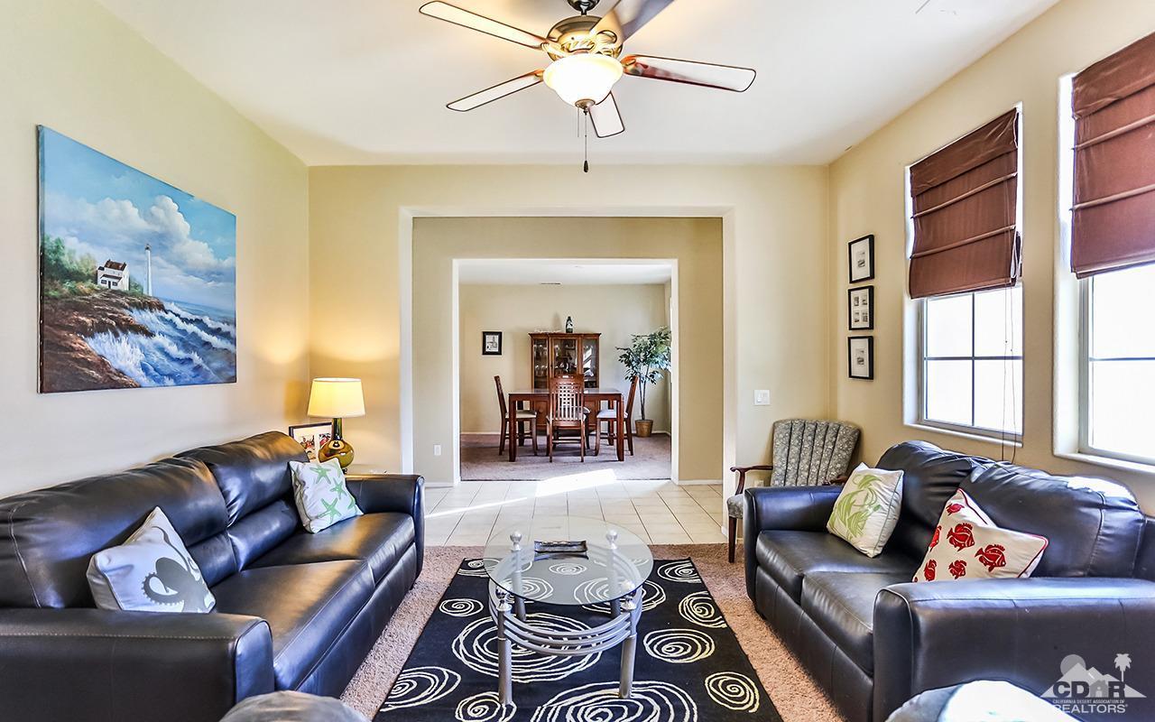 83330 Lightning Road Indio, CA 92203 - Photo 4 of 39 a living room with furniture and a large window