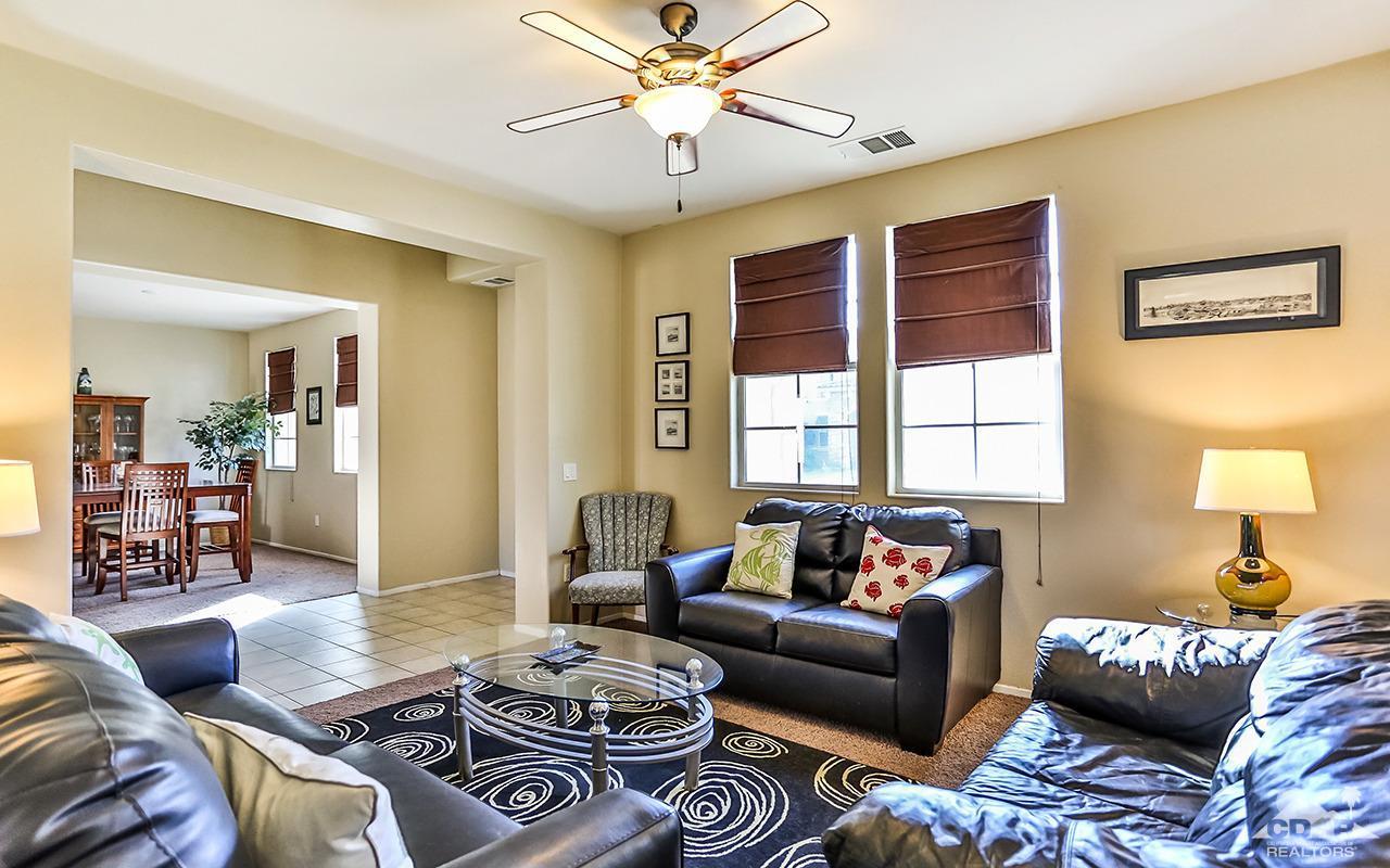 83330 Lightning Road Indio, CA 92203 - Photo 5 of 39 a living room with furniture and a window
