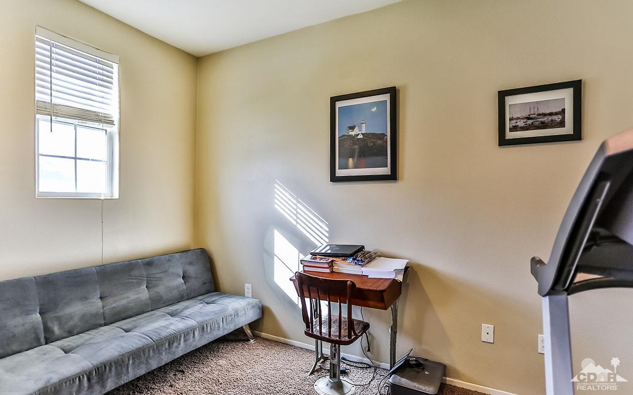 83330 Lightning Road Indio, CA 92203 - Photo 6 of 39 a living room with furniture and a window