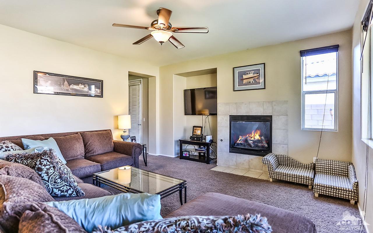83330 Lightning Road Indio, CA 92203 - Photo 8 of 39 a living room with furniture and a fireplace
