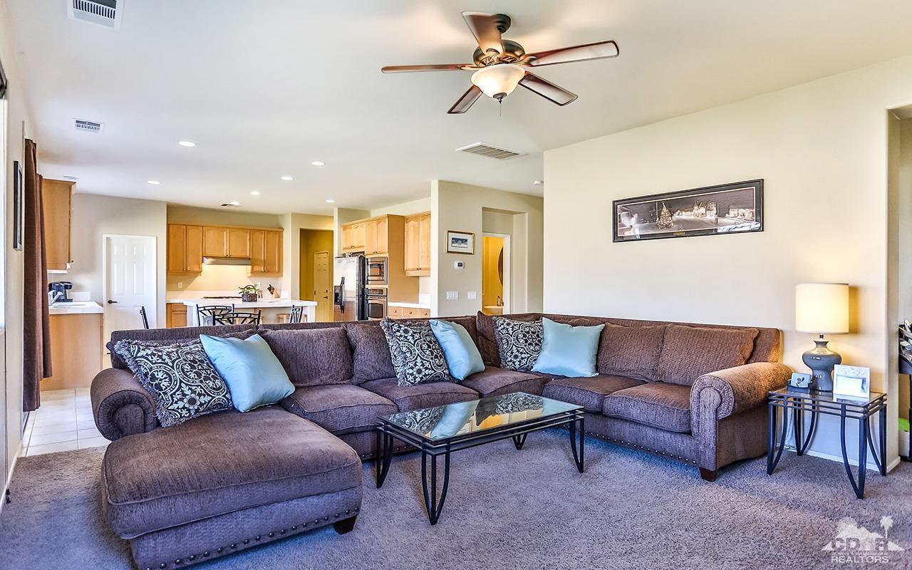 83330 Lightning Road Indio, CA 92203 - Photo 9 of 39 a living room with furniture and a ceiling fan