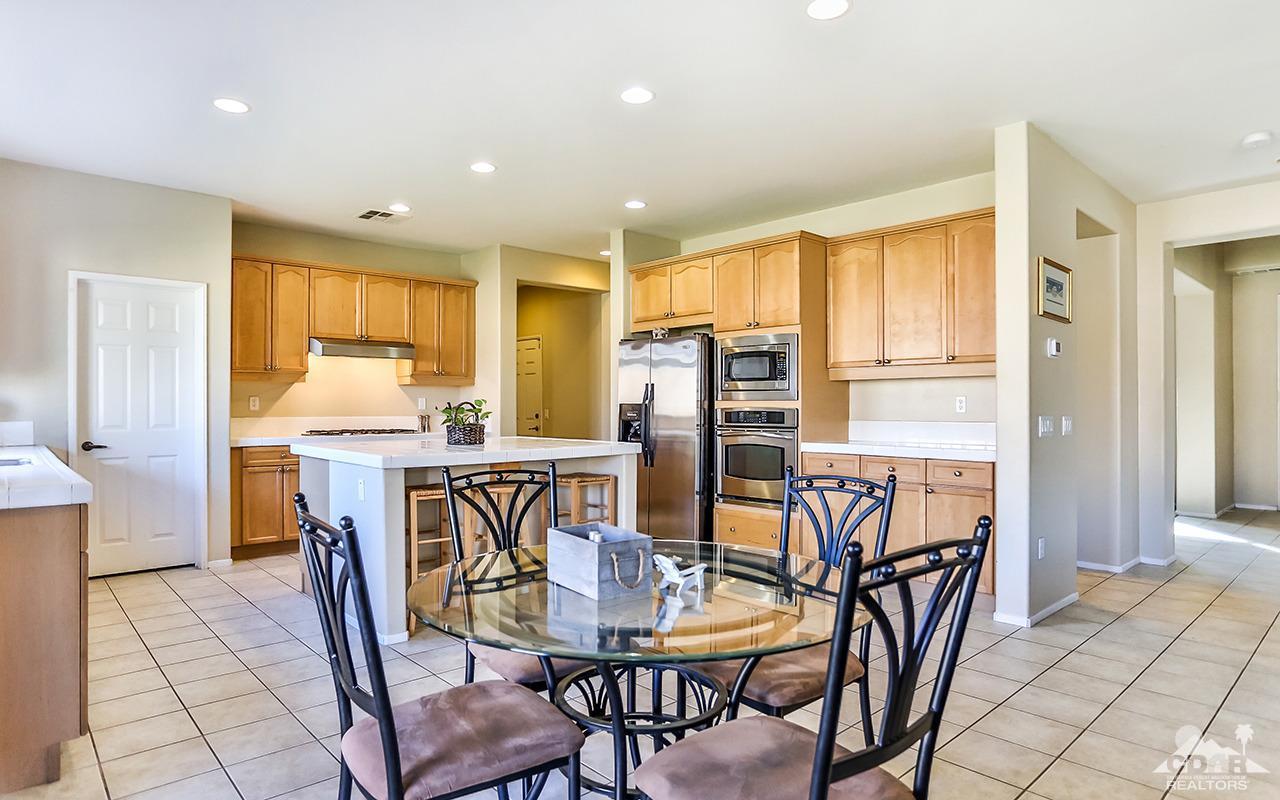83330 Lightning Road Indio, CA 92203 - Photo 10 of 39 a dining room with furniture and window