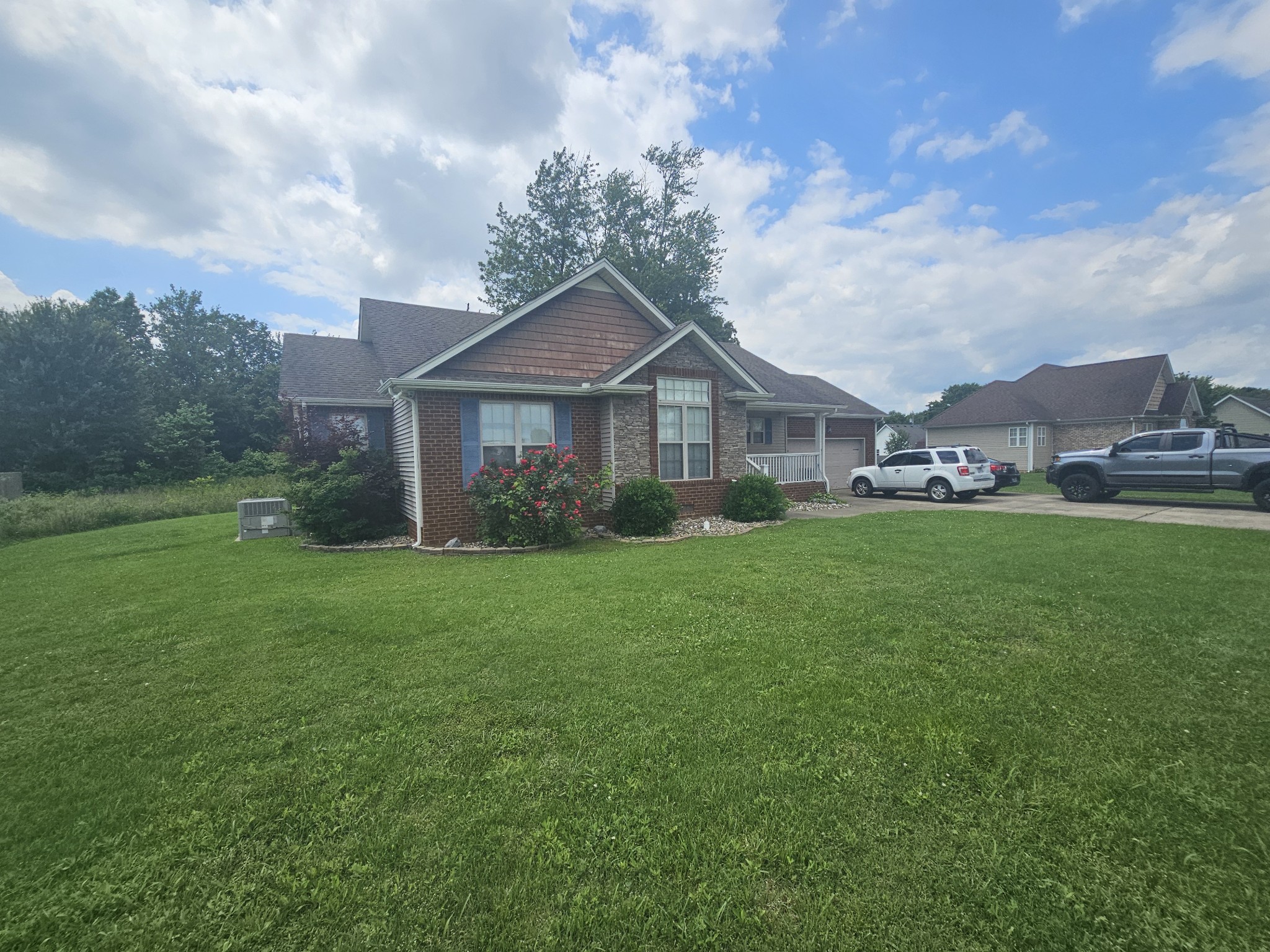 328 Airport Road Portland, TN 37148 - Photo 2 of 50 a front view of a house with garden