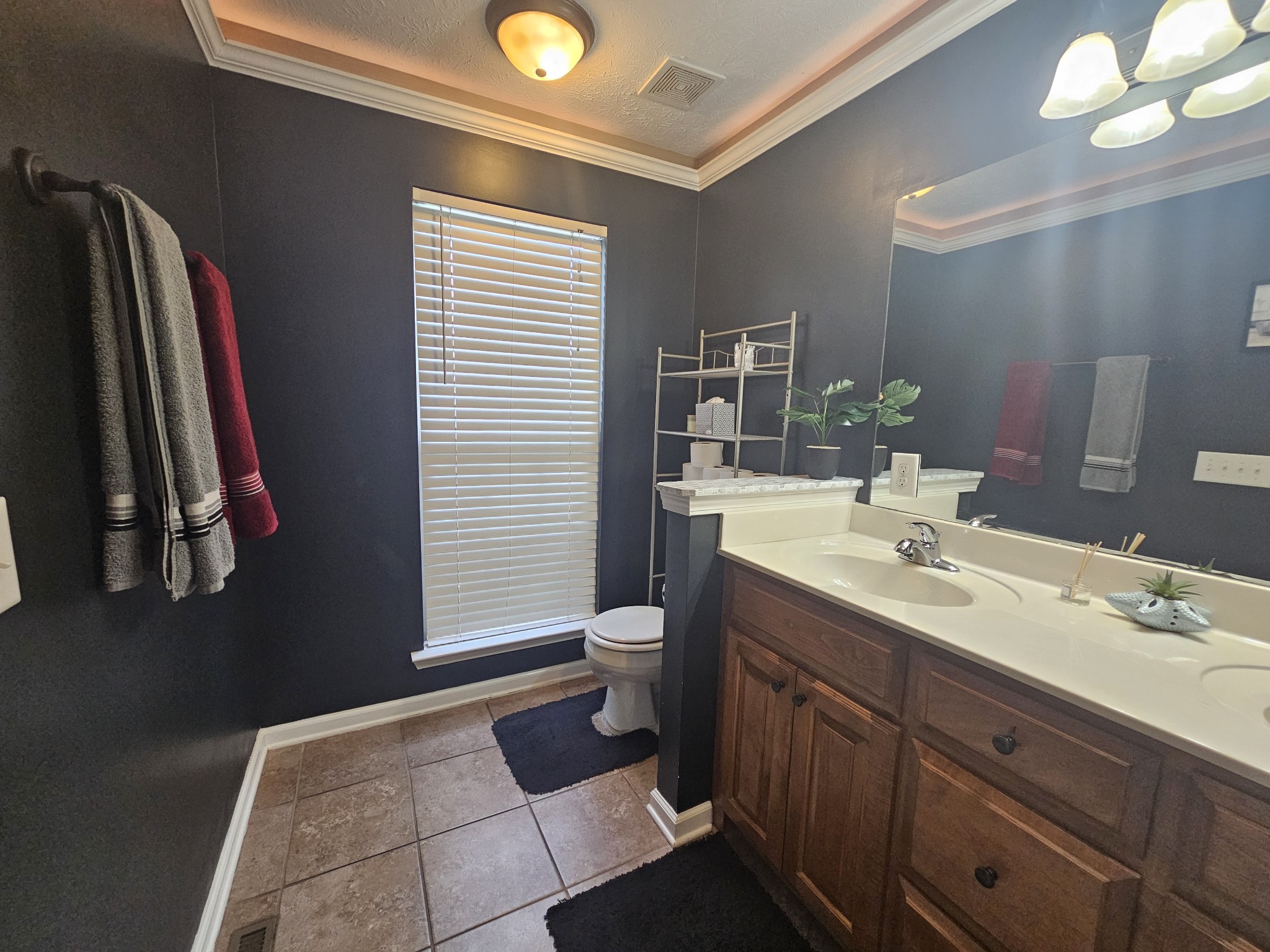 328 Airport Road Portland, TN 37148 - Photo 24 of 50 a bathroom with a toilet a sink and mirror