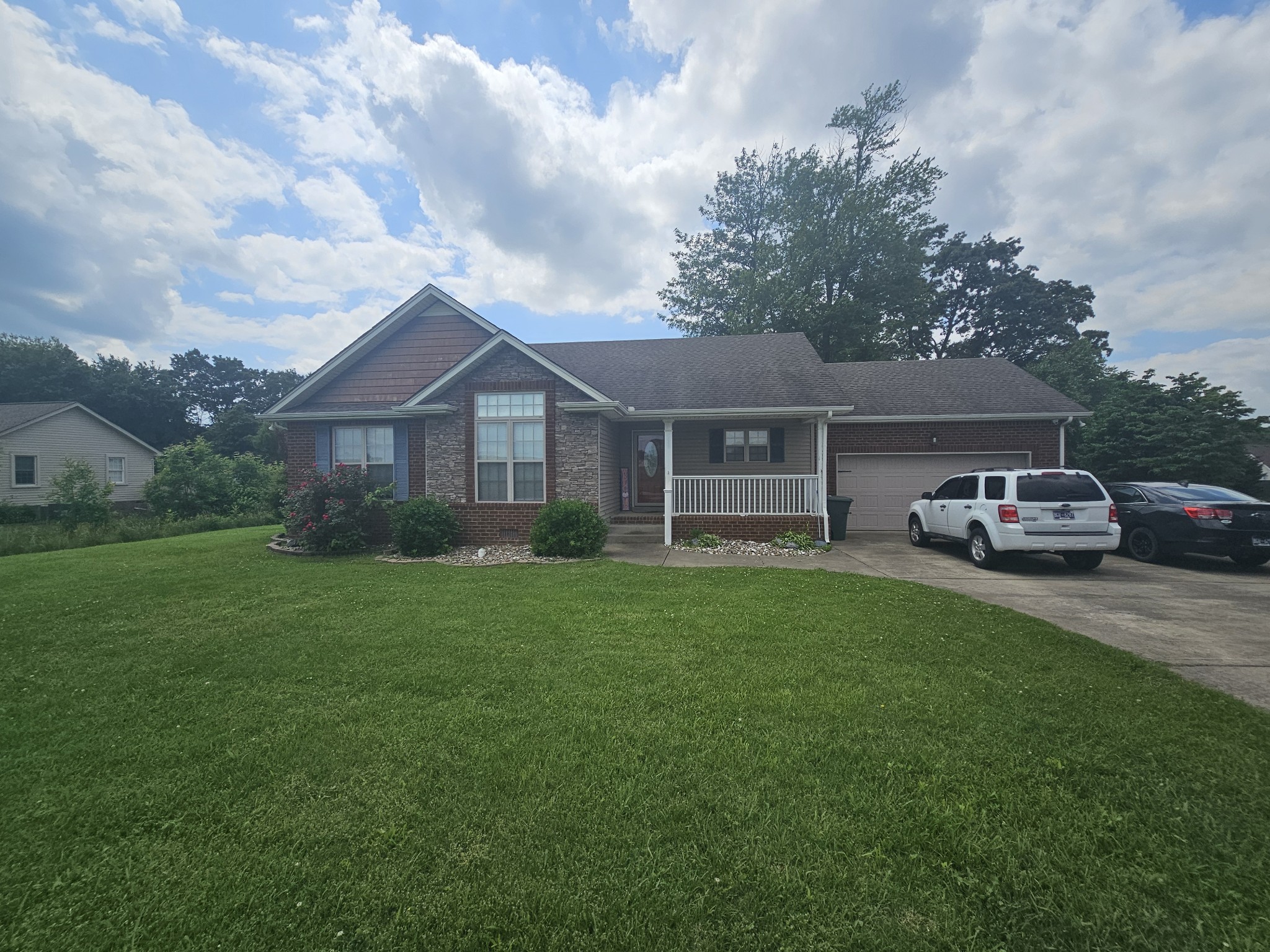 328 Airport Road Portland, TN 37148 - Photo 5 of 50 a house view with a garden space