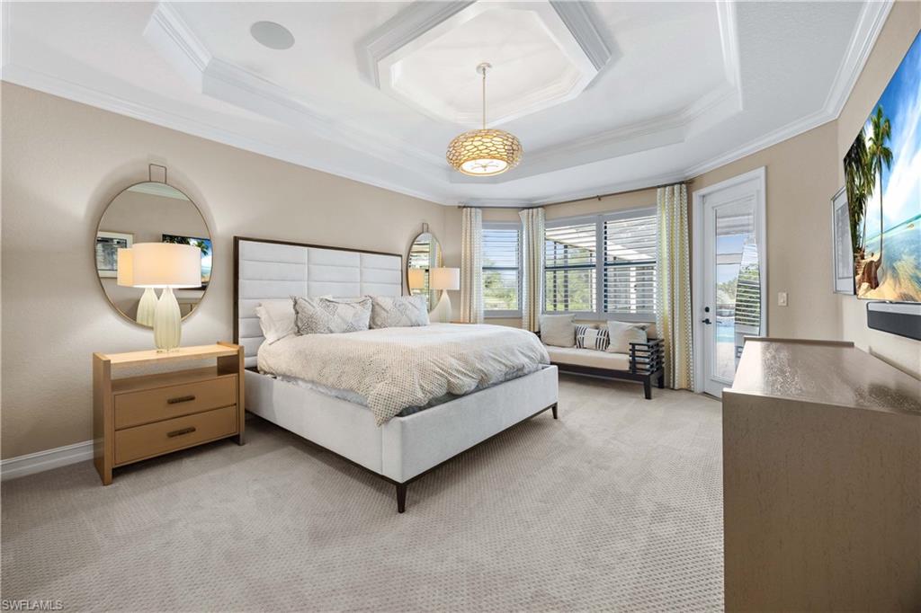 9852 Corso Bello Drive Naples, FL 34113 - Photo 22 of 50 Bedroom with access to exterior, carpet, crown molding, and a raised ceiling