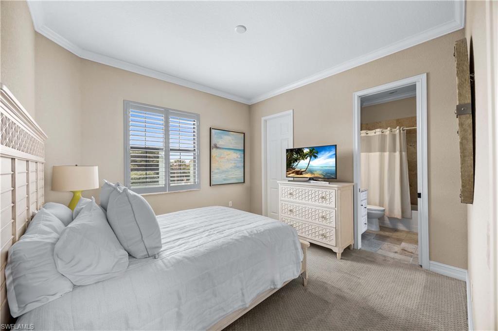 9852 Corso Bello Drive Naples, FL 34113 - Photo 30 of 50 Carpeted bedroom with crown molding