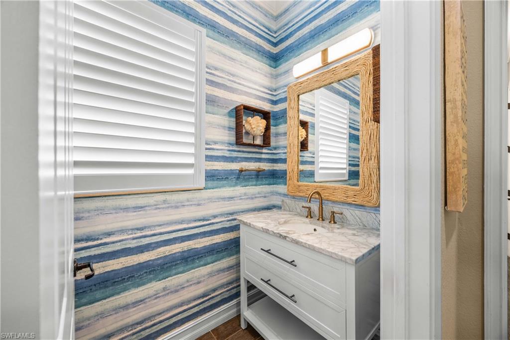 9852 Corso Bello Drive Naples, FL 34113 - Photo 38 of 50 Bathroom with vanity and wallpapered walls