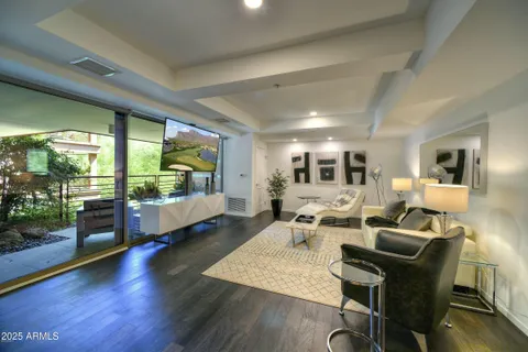 a living room with furniture and a large window