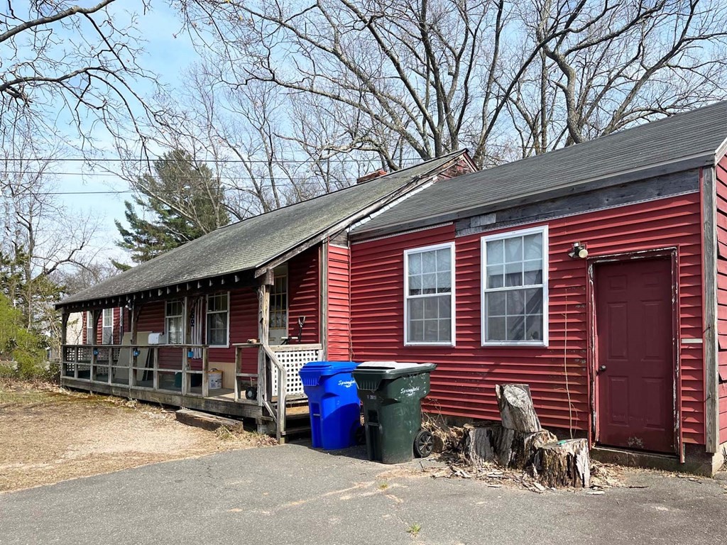447 Plumtree Road Springfield, MA 01118 - Photo 1 of 10 a backyard of a house with barbeque oven table and chairs