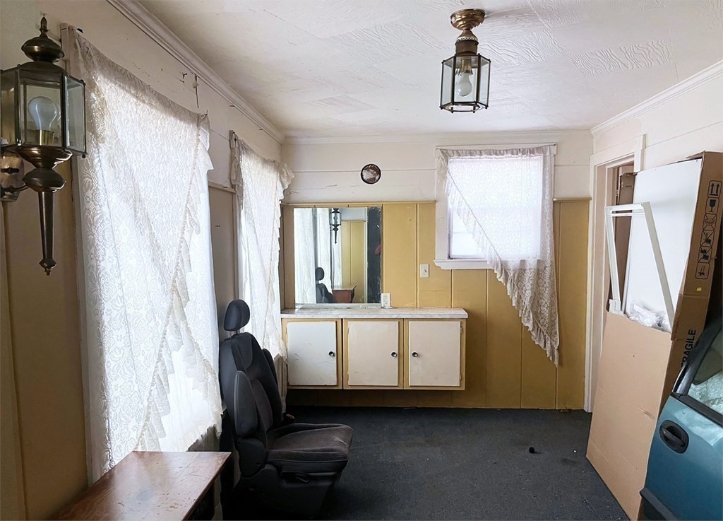 447 Plumtree Road Springfield, MA 01118 - Photo 6 of 10 a living room with furniture and a window