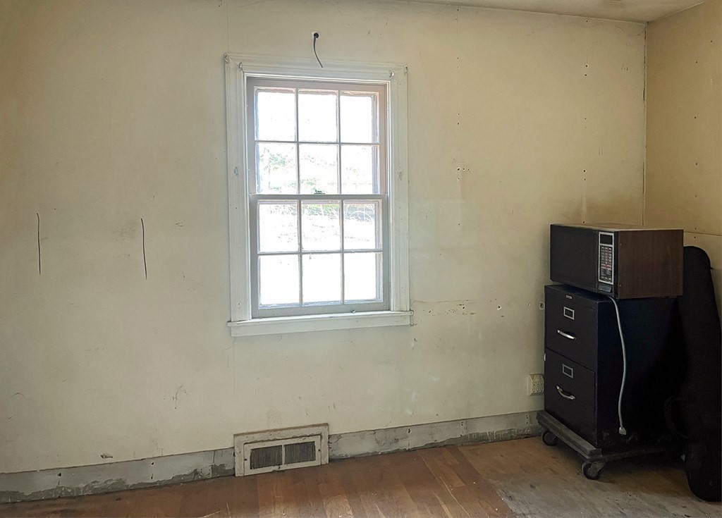 447 Plumtree Road Springfield, MA 01118 - Photo 7 of 10 an empty room with a window