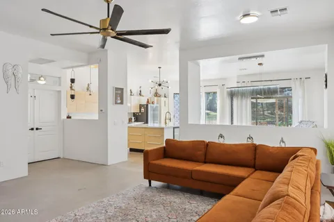 a living room with furniture and a window