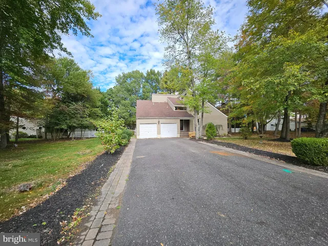 a view of a field with an trees