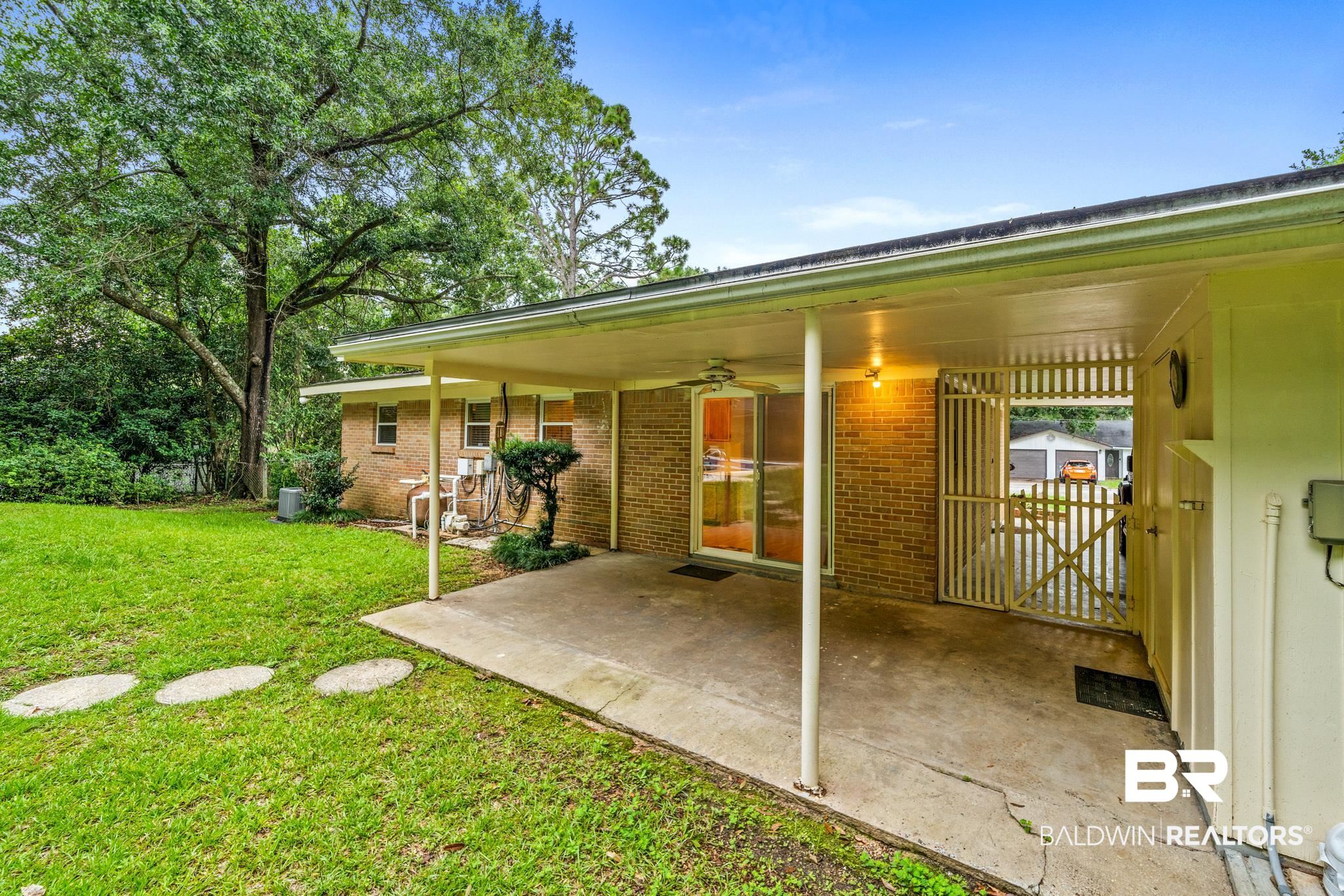 280 Thrift Street Mobile, AL 36609 - Photo 15 of 22 Rear view of house featuring a patio area, a lawn, and ceiling fan