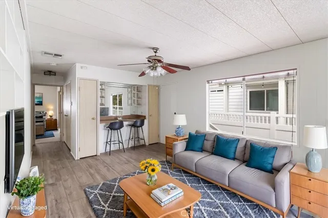 a en suite bathroom with a granite countertop sink and a mirror