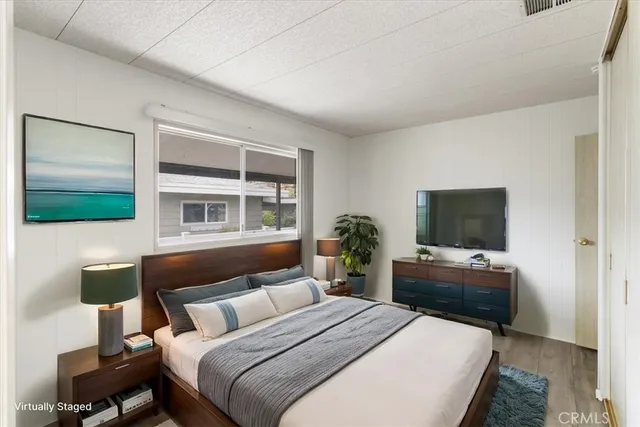 a view of a dining room with a table and chairs