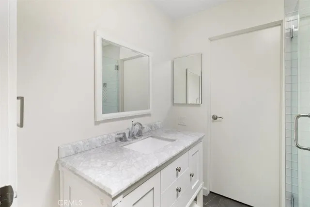 a living room with stainless steel appliances kitchen island granite countertop furniture and a large window