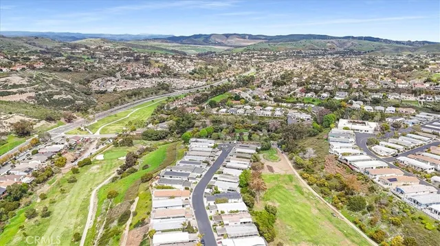 a view of a swimming pool and trees in the background