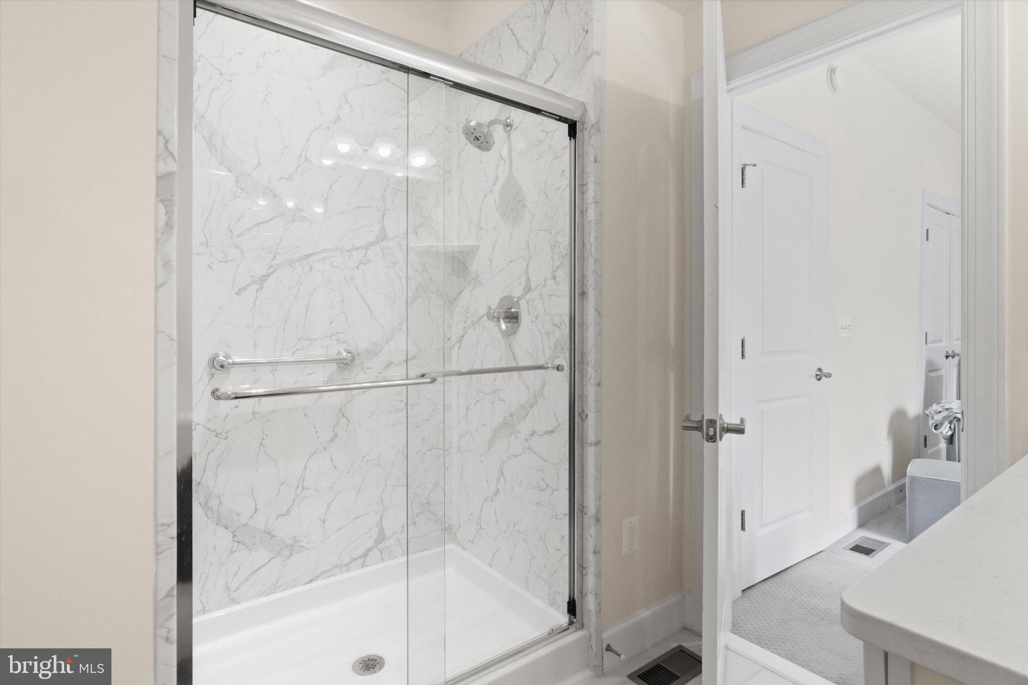 3702 Ambrose Hills Road Falls Church, VA 22041 - Photo 30 of 49 Sleek marble shower with modern design.