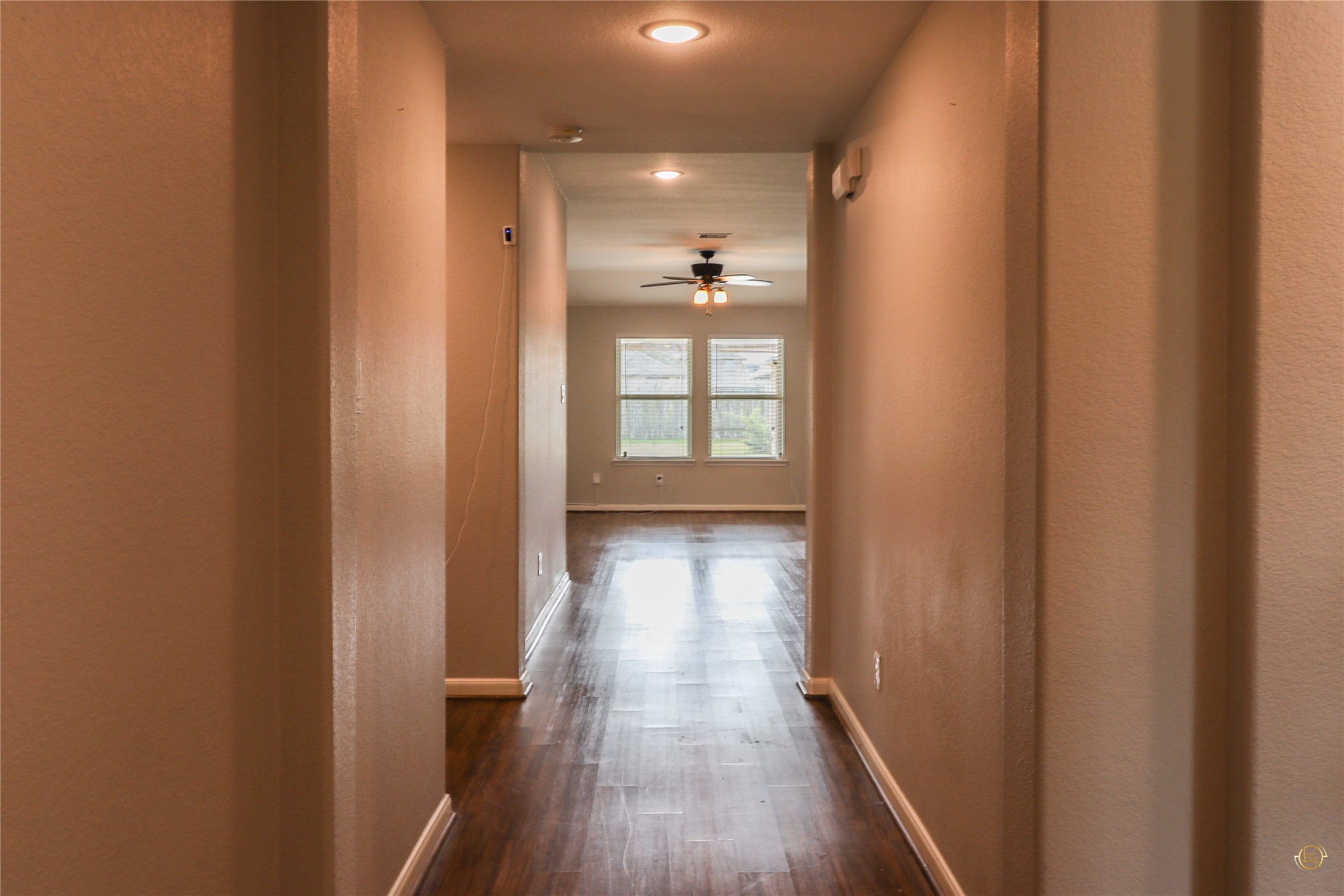 61 Rodeo Crest Drive Manvel, TX 77578 - Photo 14 of 30 a view of a hallway with wooden floor and staircase