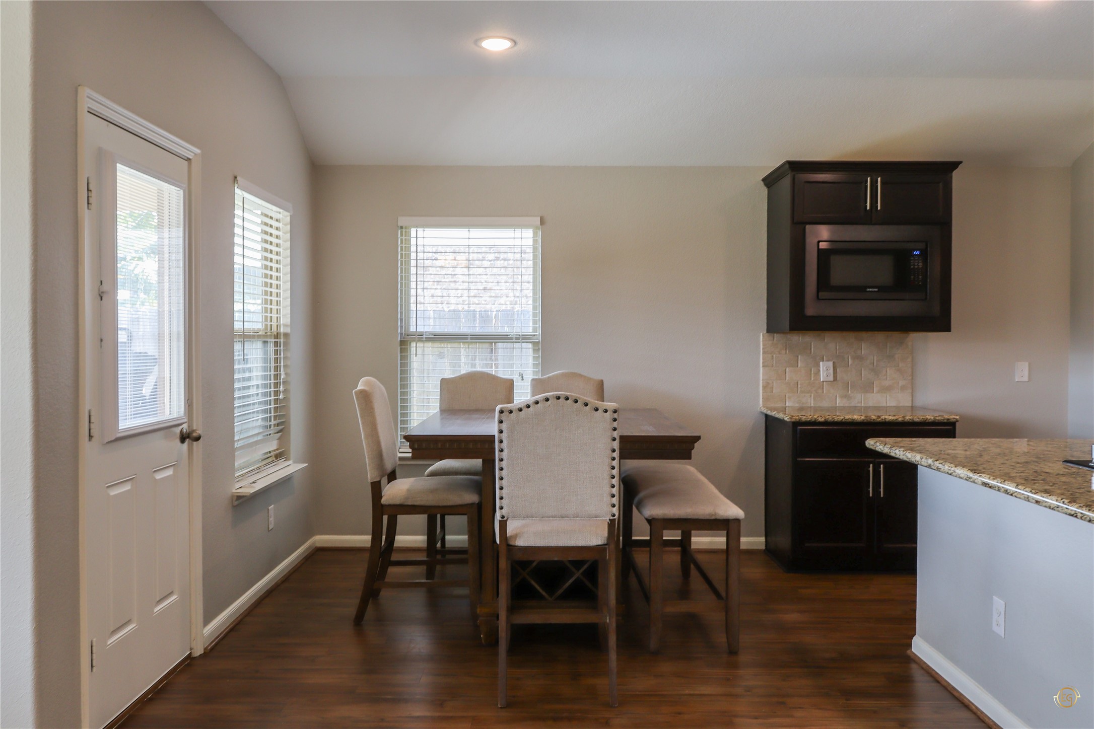 61 Rodeo Crest Drive Manvel, TX 77578 - Photo 21 of 30 a view of a dining room with furniture and wooden floor