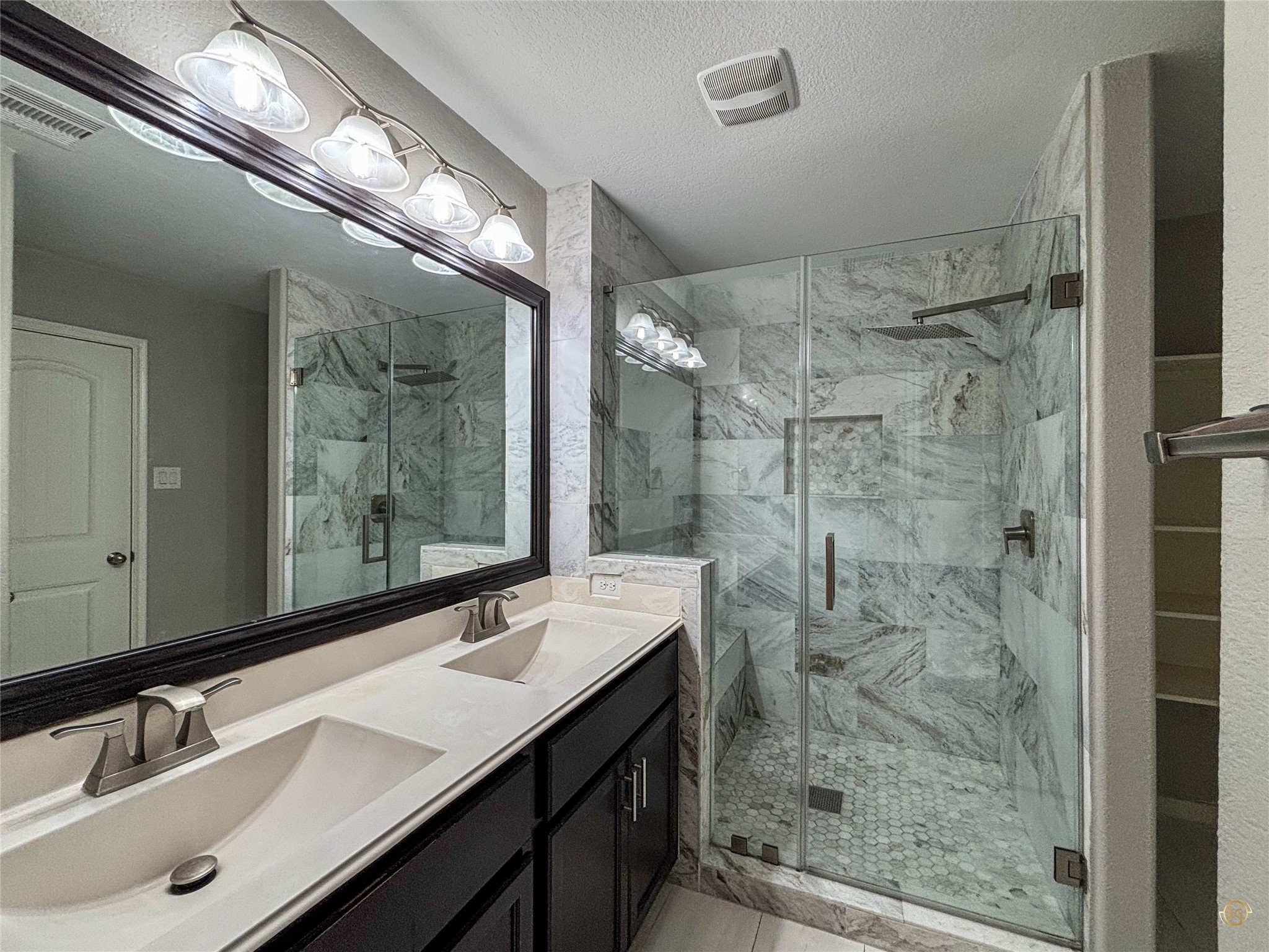 61 Rodeo Crest Drive Manvel, TX 77578 - Photo 27 of 30 a bathroom with a shower sink and mirror