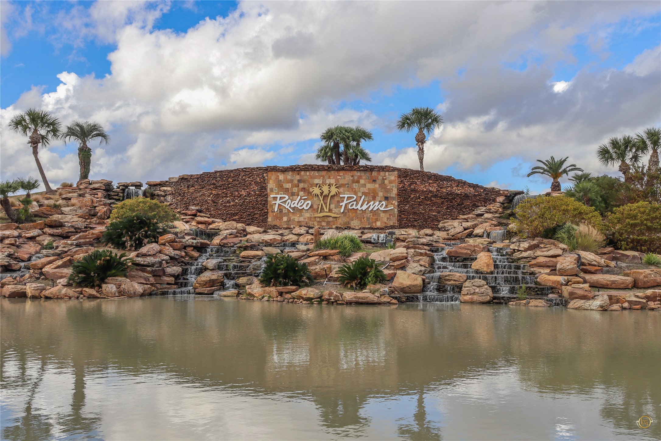 61 Rodeo Crest Drive Manvel, TX 77578 - Photo 30 of 30 a view of a lake with a building in the background