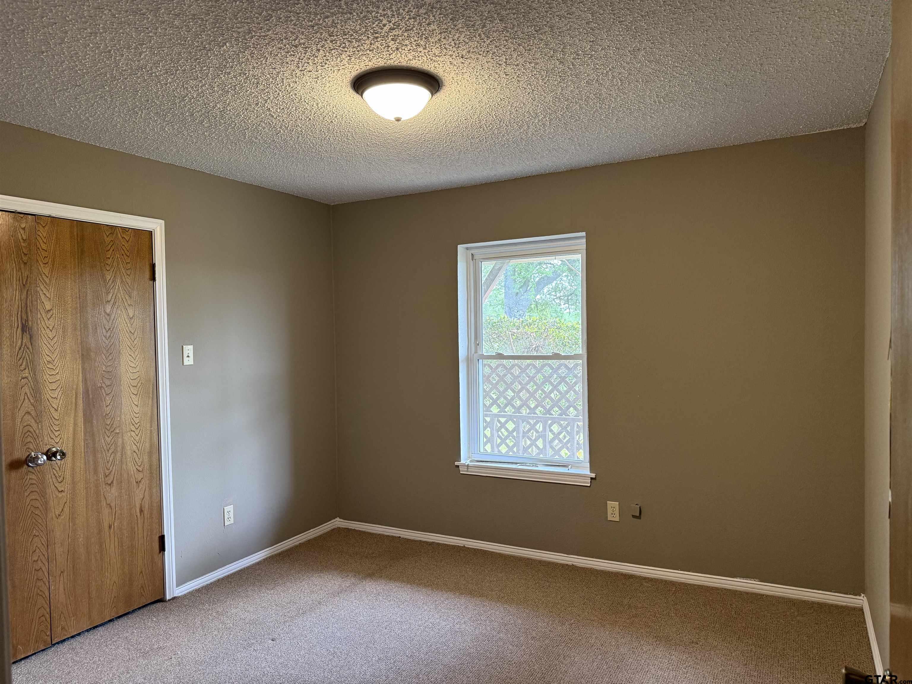 300 Black Oak Road Como, TX 75431 - Photo 12 of 34 an empty room with windows