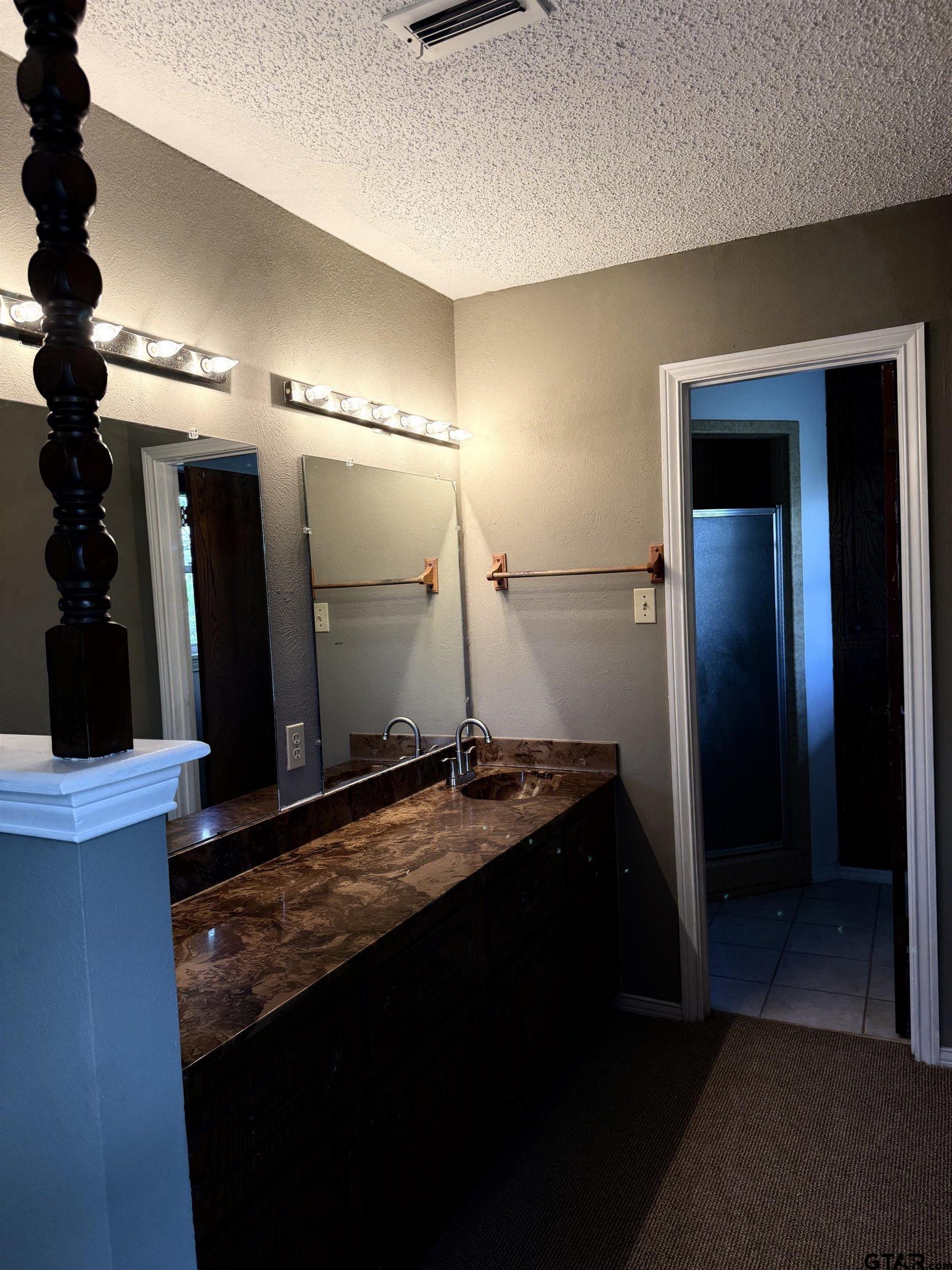 300 Black Oak Road Como, TX 75431 - Photo 14 of 34 a bathroom with a sink and a mirror