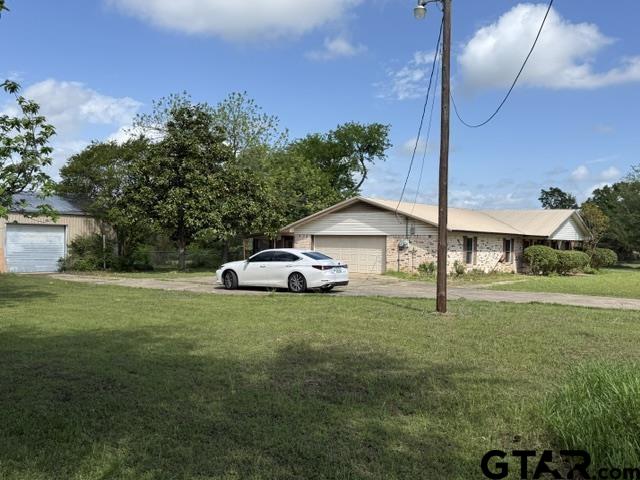 300 Black Oak Road Como, TX 75431 - Photo 2 of 34 a white house covered with tall trees