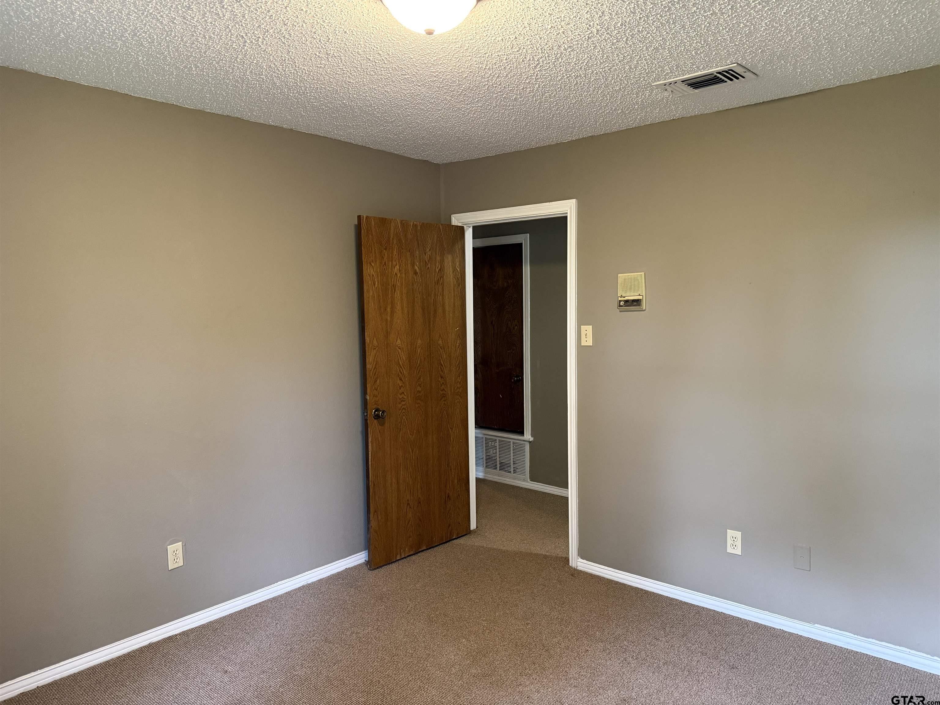 300 Black Oak Road Como, TX 75431 - Photo 21 of 34 an empty room and closet area