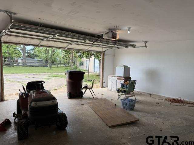 300 Black Oak Road Como, TX 75431 - Photo 28 of 34 a living room with patio furniture and a floor to ceiling window