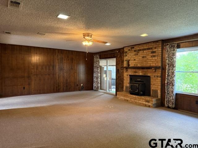 300 Black Oak Road Como, TX 75431 - Photo 8 of 34 a view of an empty room with a fireplace and a window