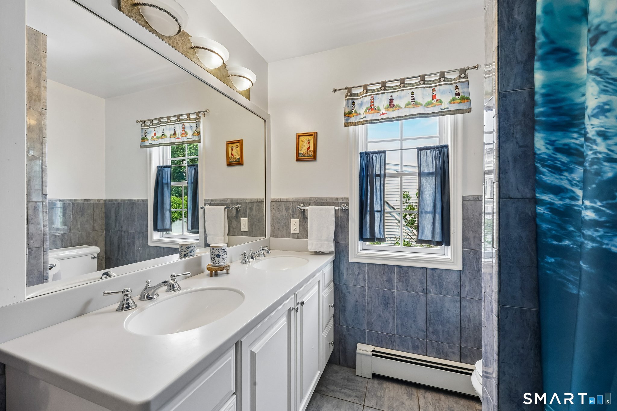 21 Friendly Road Norwalk, CT 06851 - Photo 13 of 28 Another full bathroom located on the upper level with tub/shower combination and double sink making morning routines a little easier!