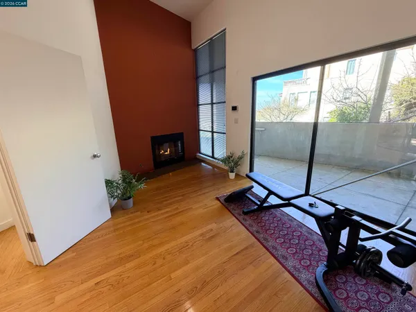 a view of living room with furniture and wooden floor