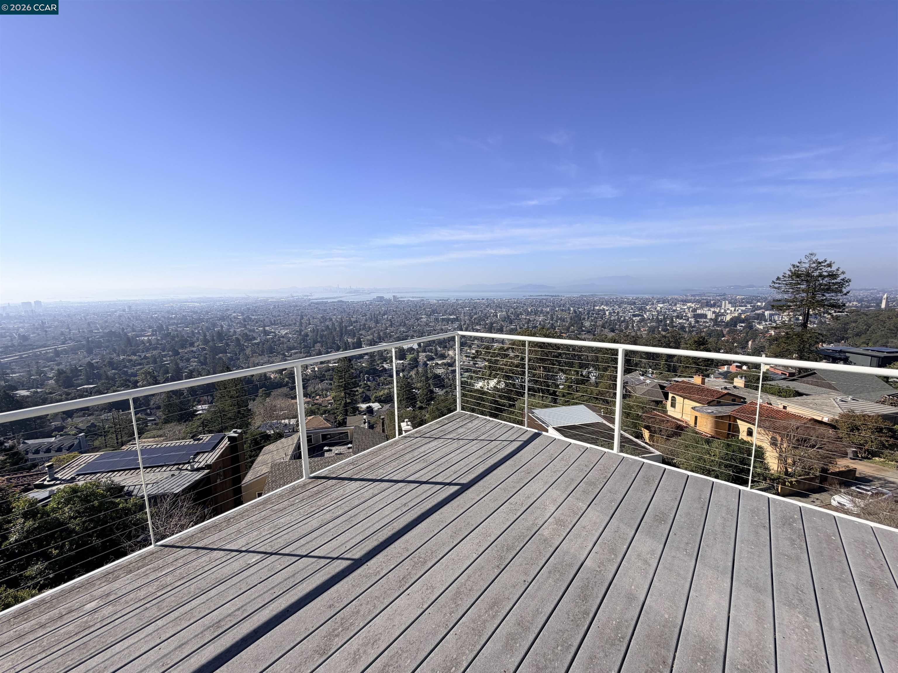 Claremont Hills Berkeley, CA 94705 - Photo 3 of 21 a view of roof deck with two chairs and wooden floor