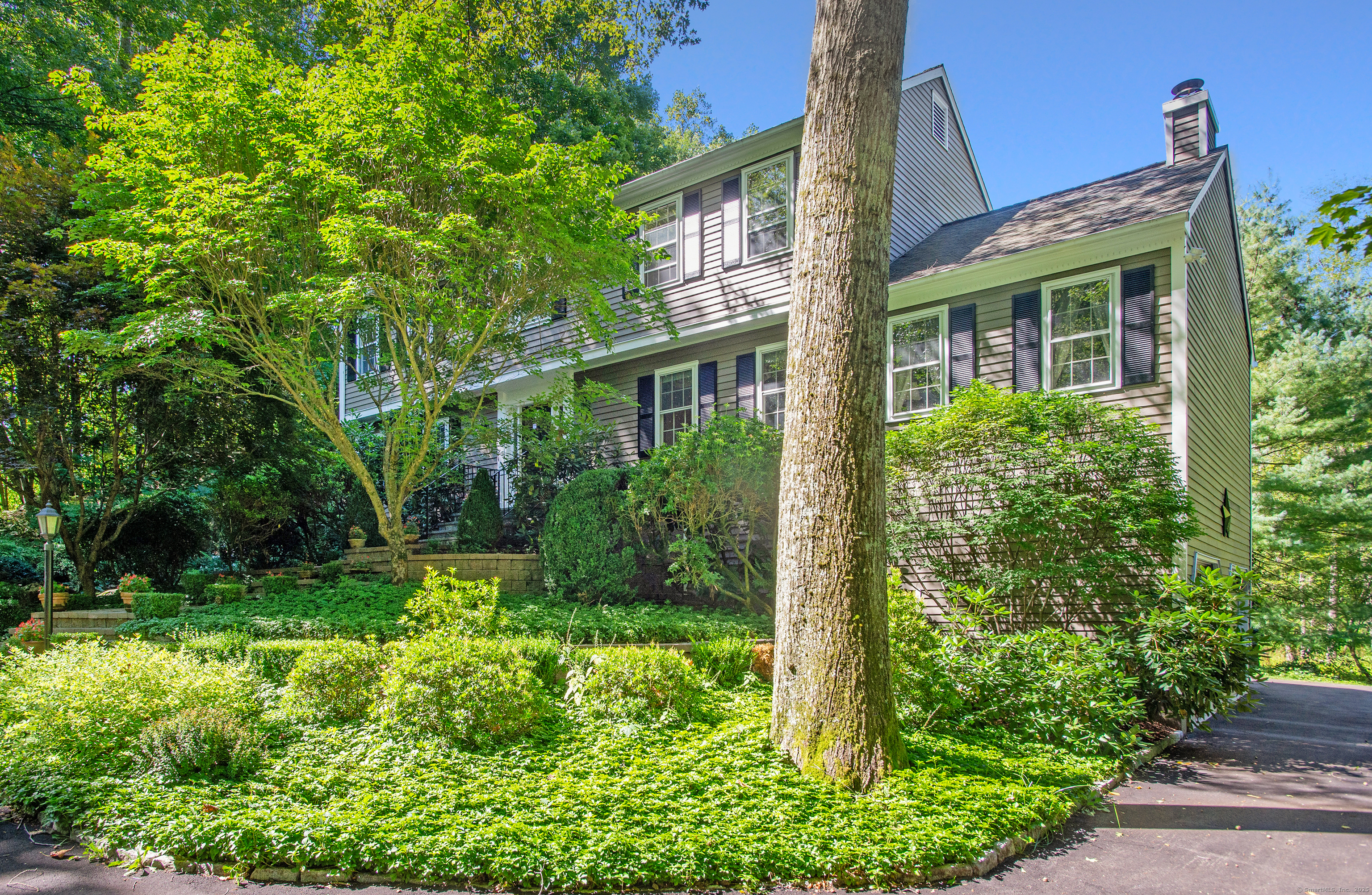 front view of a house with a yard