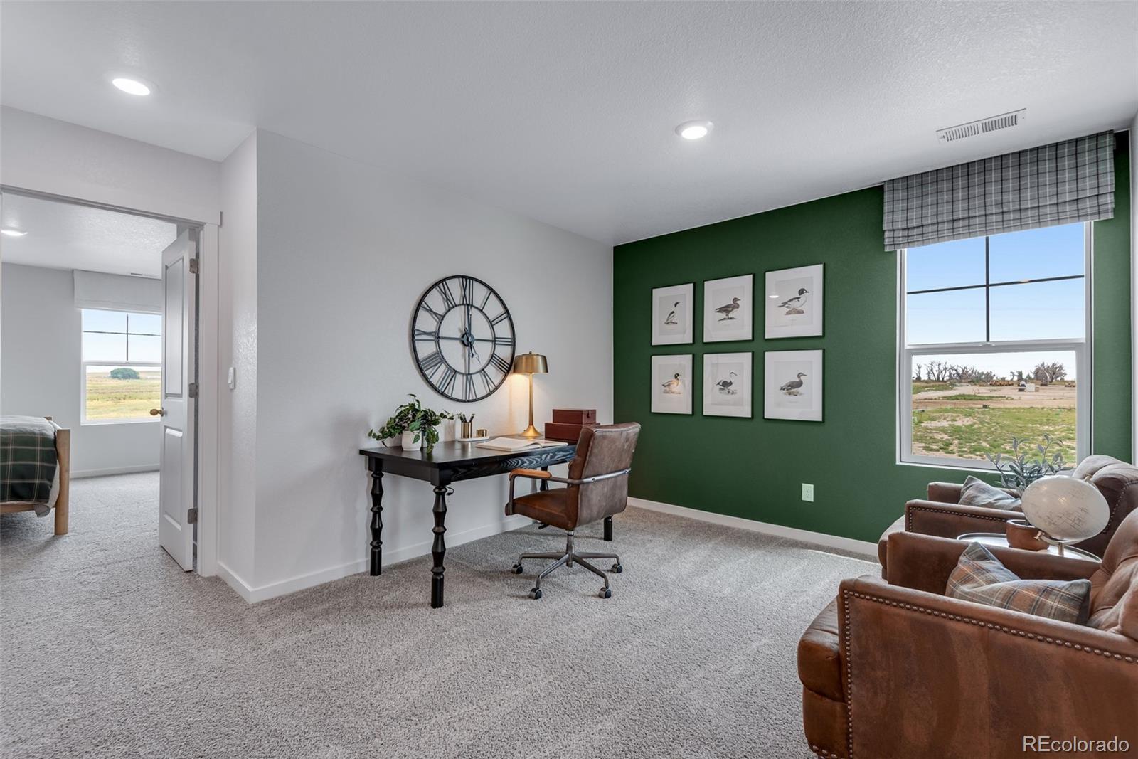 612 South Cabernet Avenue Fort Lupton, CO 80621 - Photo 24 of 49 a living room with furniture and a window