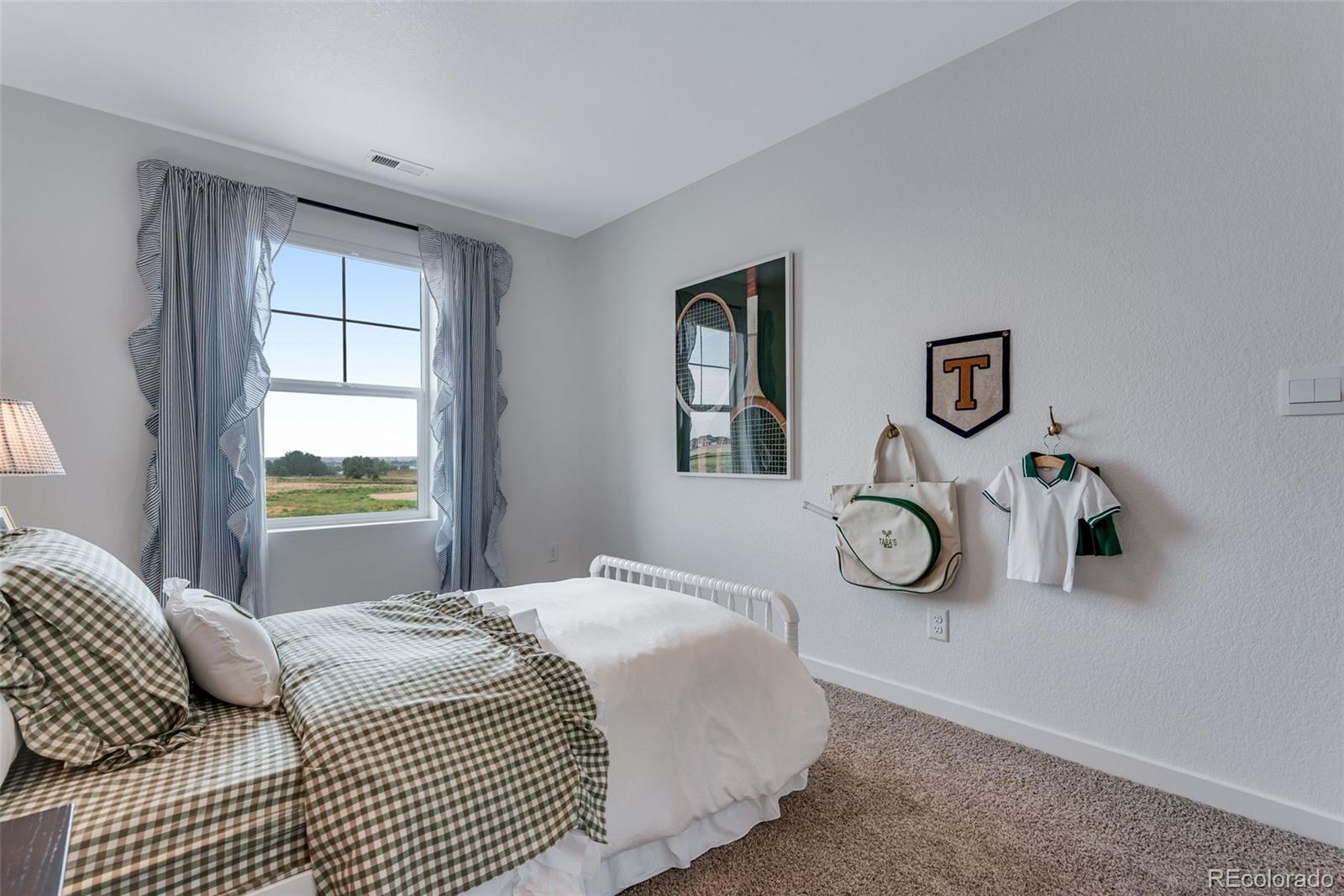 612 South Cabernet Avenue Fort Lupton, CO 80621 - Photo 37 of 49 a bedroom with a bed and a window