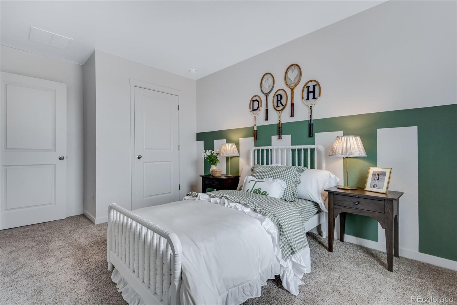 612 South Cabernet Avenue Fort Lupton, CO 80621 - Photo 38 of 49 a bedroom with a bed and a lamp on table