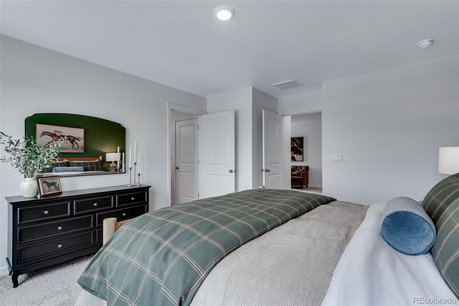 612 South Cabernet Avenue Fort Lupton, CO 80621 - Photo 43 of 49 a bedroom with a bed and a television