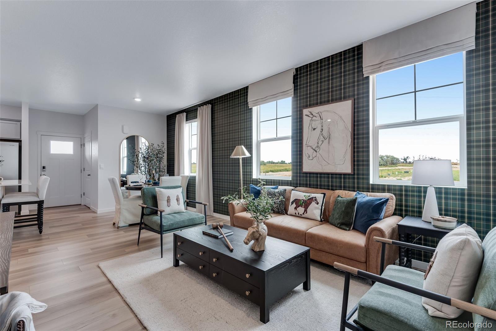 612 South Cabernet Avenue Fort Lupton, CO 80621 - Photo 9 of 49 a living room with furniture and a large window