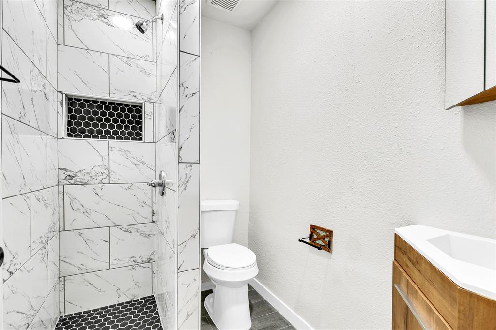 6321 Little Ranch Road North Richland Hills, TX 76182 - Photo 14 of 24 a bathroom with a toilet and a shower