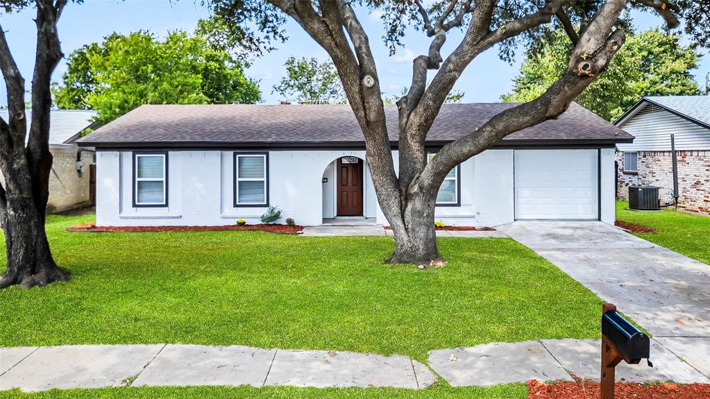 6321 Little Ranch Road North Richland Hills, TX 76182 - Photo 2 of 24 a front view of a house with a yard
