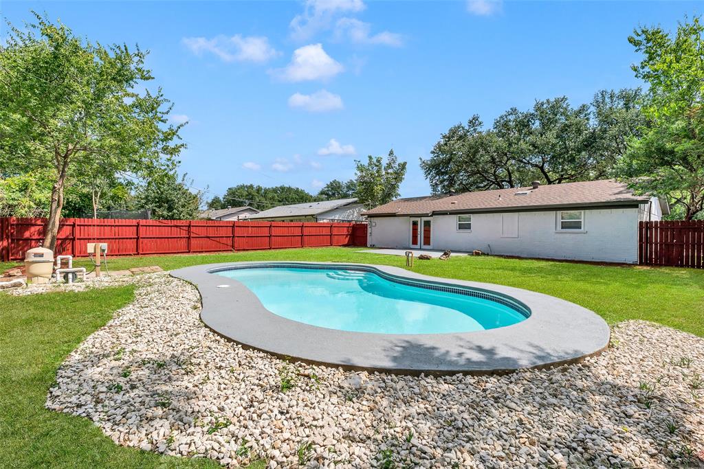 6321 Little Ranch Road North Richland Hills, TX 76182 - Photo 22 of 24 a view of a swimming pool with a yard