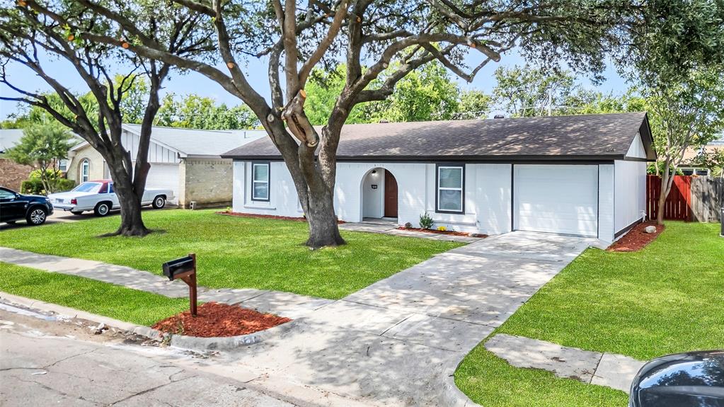 6321 Little Ranch Road North Richland Hills, TX 76182 - Photo 3 of 24 a front view of a house with a yard