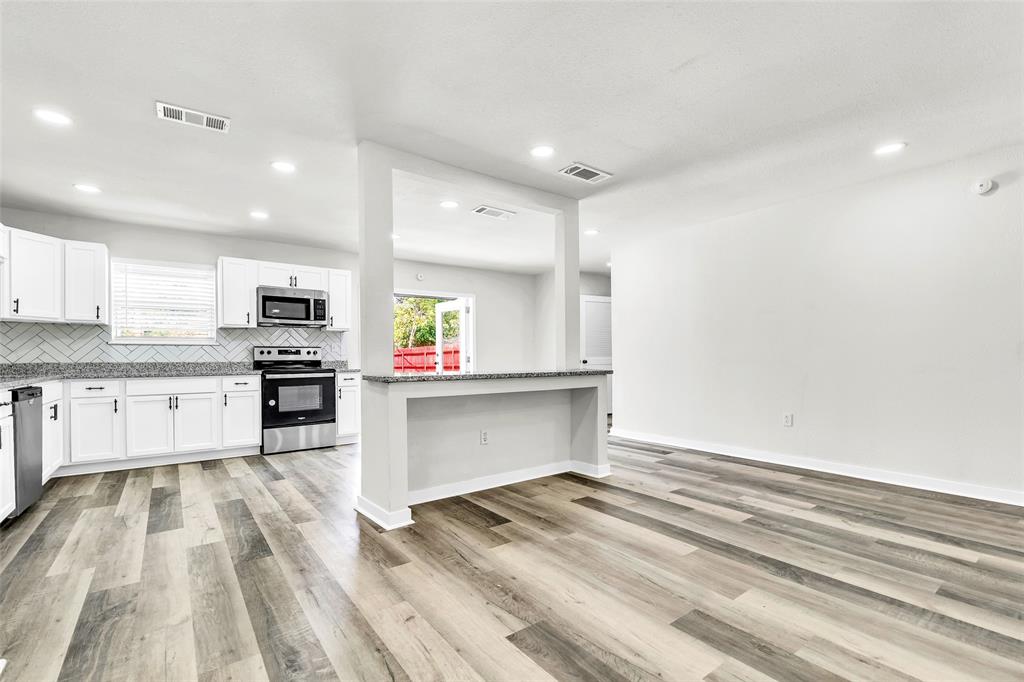 6321 Little Ranch Road North Richland Hills, TX 76182 - Photo 6 of 24 a large kitchen with a lot of counter space and stainless steel appliances