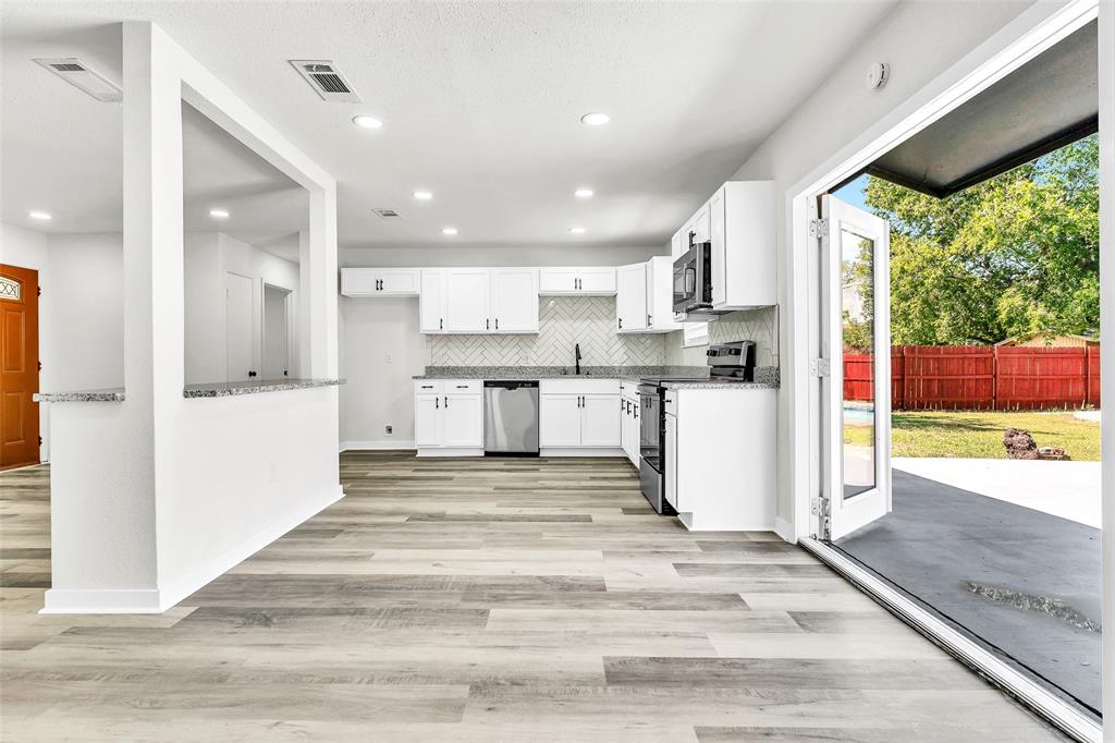 6321 Little Ranch Road North Richland Hills, TX 76182 - Photo 10 of 24 a view of kitchen with stainless steel appliances cabinets and outdoor view